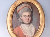 portrait of a lady in an orange dress with a red headband