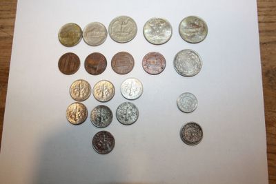 a lot of coins that are on the table
