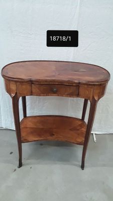 a wooden table with a shelf on top of it