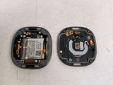 two pieces of a cell phone that are sitting on a table