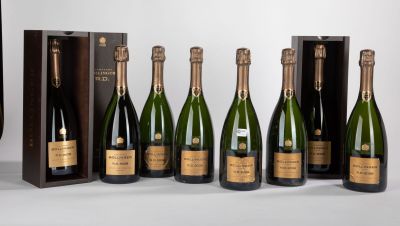 six bottles of champagne are lined up in a row