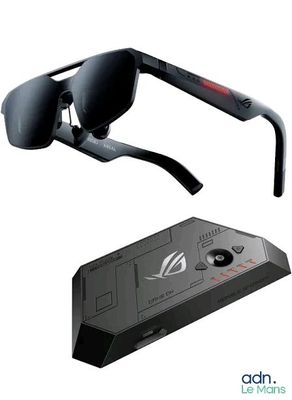 a pair of sunglasses that are next to a remote control