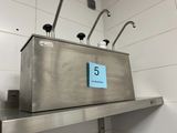 a metal box with a number on it on a shelf