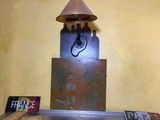 a table with a lamp on top of it in a room