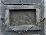 a picture of a wooden frame hanging on a wall