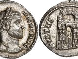 a silver coin with an image of a man and a woman on it