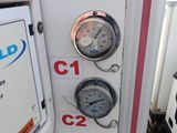 a close up of a gas station with gauges on the wall