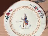 a plate that has a picture of a man on it
