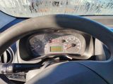 steering wheel of a car with a speedometer and a digital display