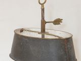 a lamp that is on a stand with a lamp shade on top of it