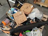 a black umbrella sitting on a pallet in a warehouse