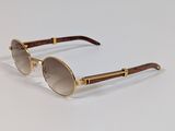 the sunglasses are made of wood and metal with a brown lens
