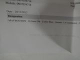 a close up of a document with a cell phone on it