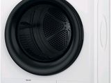 a close up of a washing machine with the door open