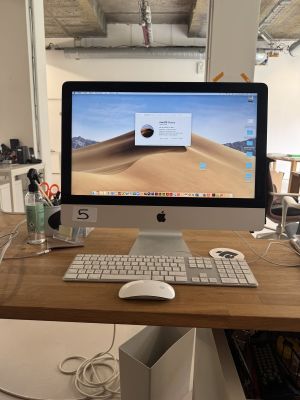 a computer on a desk with a keyboard and mouse
