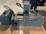 a machine that is sitting on a box in a warehouse