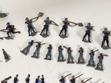 a lot of figurines that are on a table