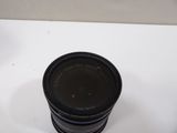 a camera lens sitting on top of a white table
