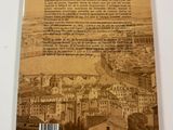 the back cover of a book with an image of a city