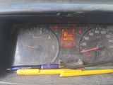 a car dashboard with a yellow marker and a yellow pen