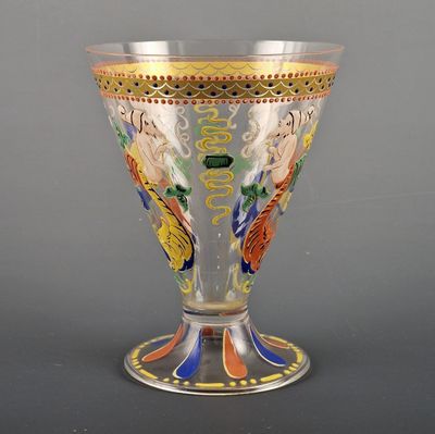 a glass vase with a design on it on a table