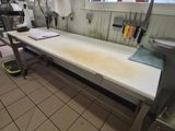 a kitchen with a sink, counter, and other items in it