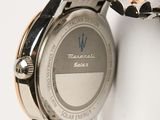 an image of a close up of a watch on a white surface