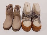 trois paires de bottes d'hiver pour femmes alignées sur une surface blanche