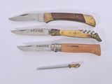five different types of knives on a white surface