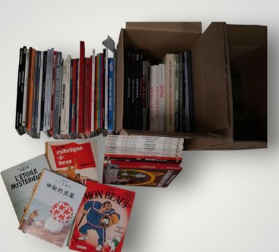 a box full of books on a white table