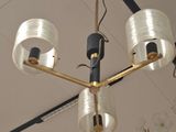 a chandelier hanging from the ceiling in a room