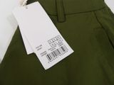 a tag on a pair of pants hanging from a hanger