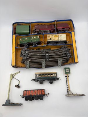 a box with a train set in it on a white surface