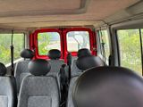 many seats in the back of a van that are empty