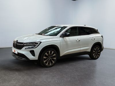 a white suv is parked in a large room