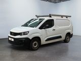 the white van is parked in a large room with a roof rack