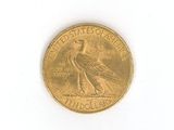 an image of a gold coin on a white surface