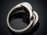a close up of a silver ring on a black surface