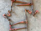 a lot of rusty tools that are laying out on the ground