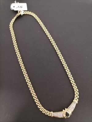 a gold chain with a diamond clasp on a black background