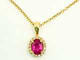 an oval ruby and diamond pendant on a gold chain