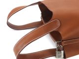 brown leather handbag with a padlock on a white background