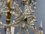 a crystal chandelier hanging from the ceiling in a room