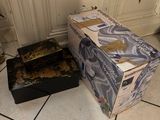 two boxes that are sitting on the floor next to each other