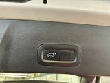 a close up of a car ' s dashboard with a remote control