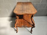 a small wooden table with a drawer on it