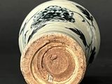 a close up of a vase with a black and white design on it