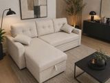 a living room with a white couch and a black coffee table