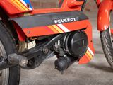 a close up of a motorcycle with a red and yellow stripe on it