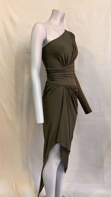 the mannequin is wearing a brown dress with a belt